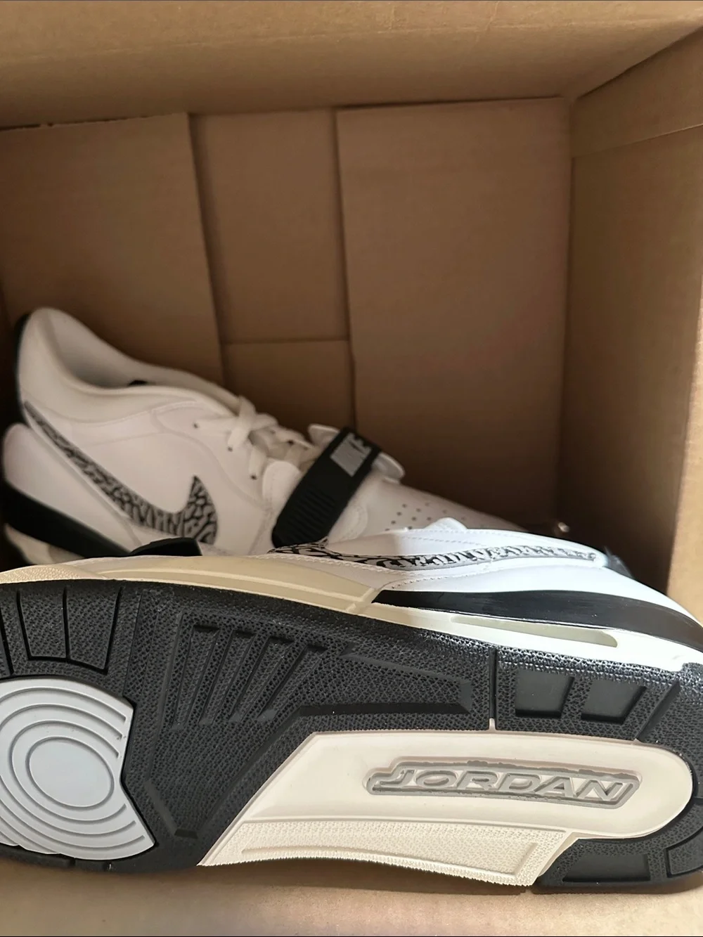 Nike Jordan Men’s White and Black Low-Top Sneakers with Patterned Swoosh